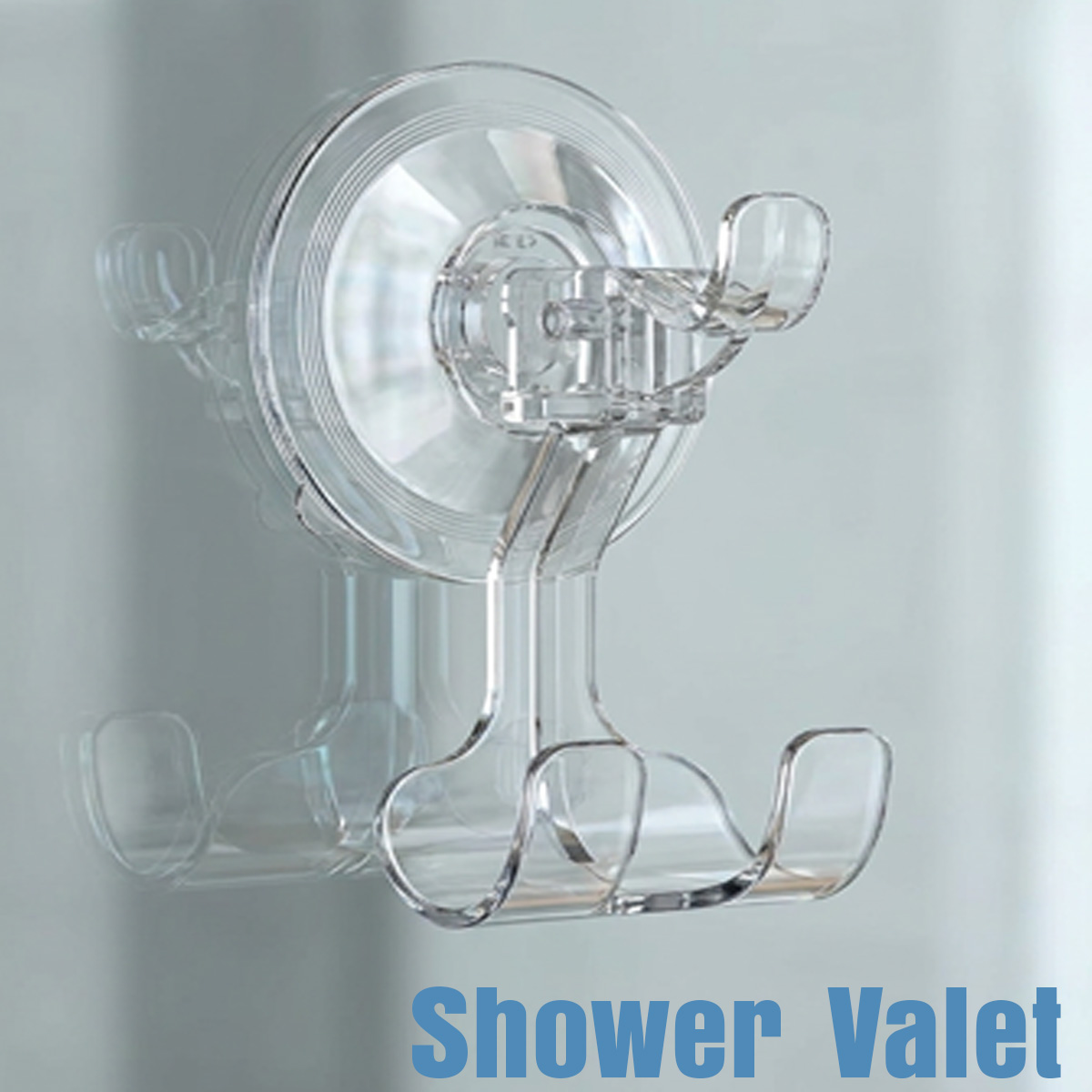 The Fähloo Shower Valet: a clear locking suction hook with a two-prong hanger, mounted on a shower wall